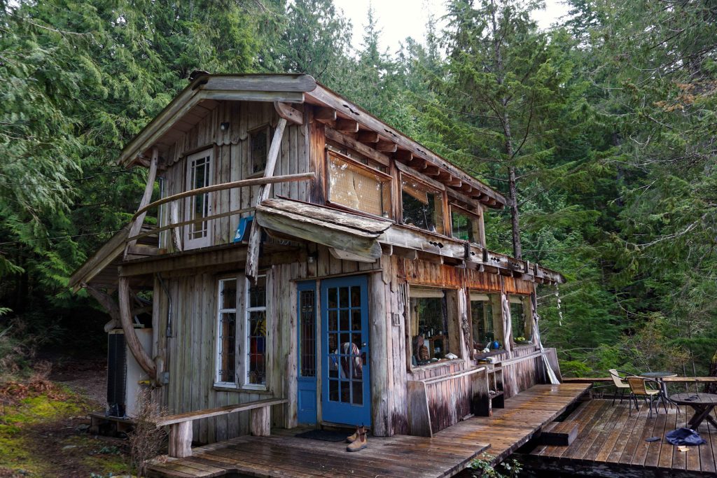 Old wood cabin surrounded by trees