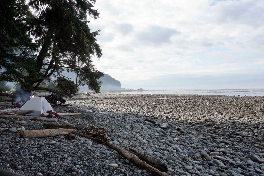 Tent pitched on empty stone beach