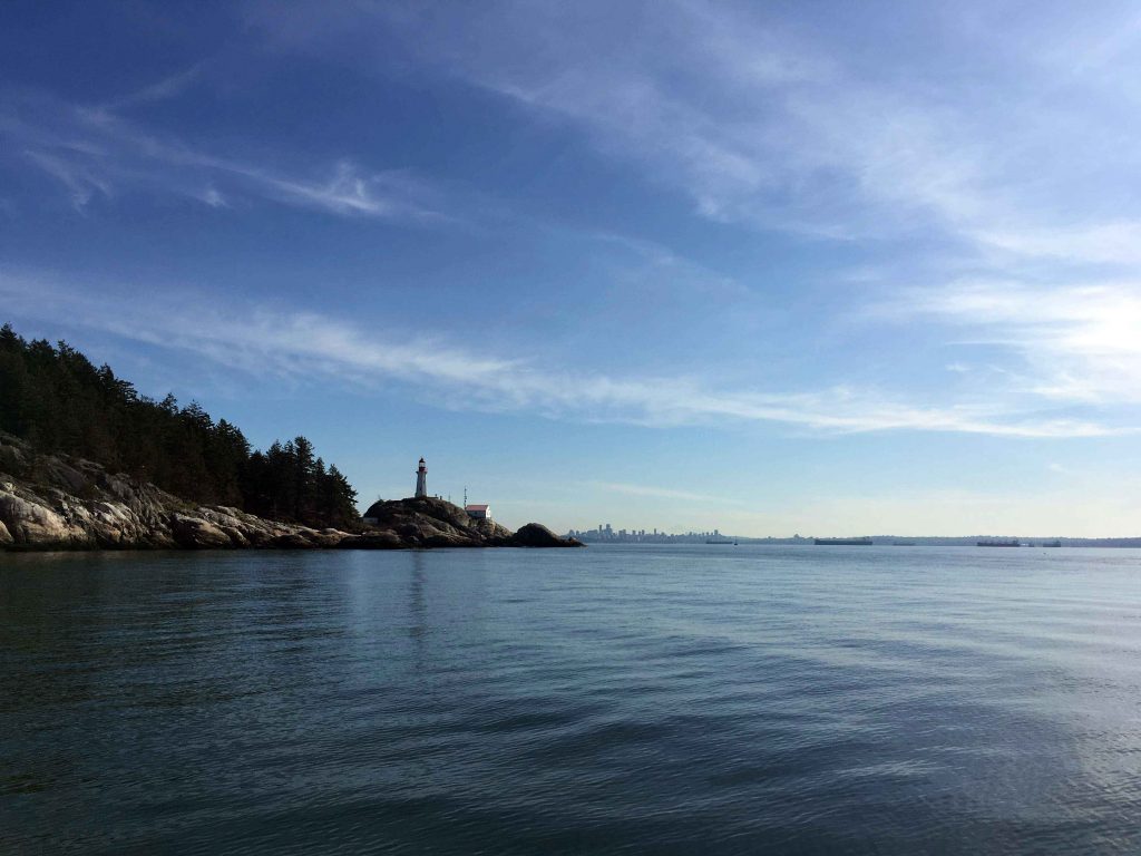 Calm sea with lighthouse in the distance