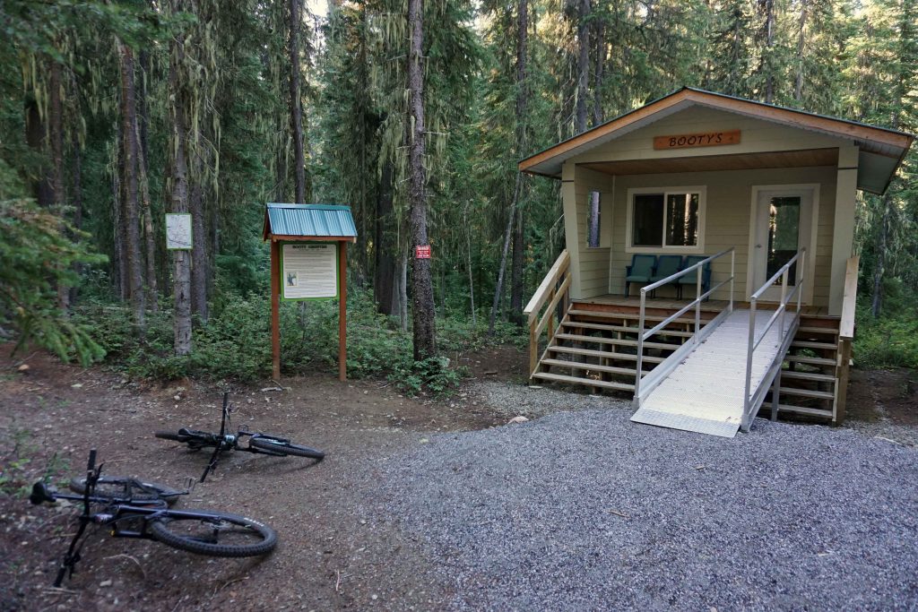 Backcountry cabin with two mountain bikes in the foreground